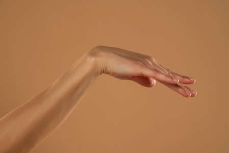 Close up profile photo of a woman smile on beige background.の写真素材