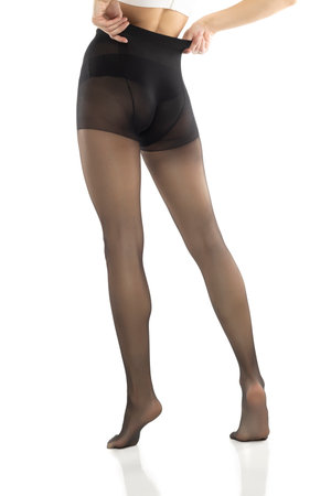 Woman puts on black stockings on her beautiful long legs, isolated on white studio backgroundの写真素材