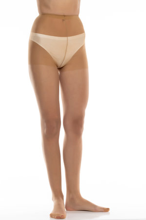 Woman wearing tights isolated on white, closeup of legs on a white studio background. Front viewの写真素材