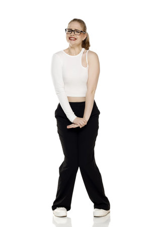 young blond woman need a toilet on white studio backgroundの写真素材