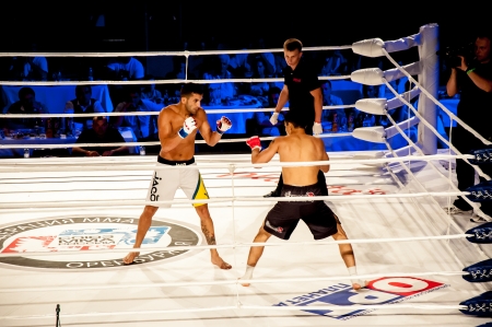 Mixed fighting Championship Edition. 29.06.2013 year, the city of Orenburg. MMA fights without rules. Blue corner Agoni Romero, Spain and in the Red corner, Rinat Kul?tumanov, Russia. Victory Agoni Romero.のeditorial素材