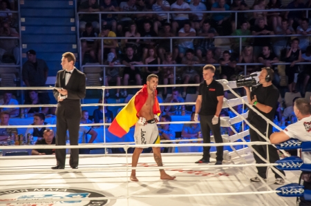 Mixed fighting Championship Edition. 29.06.2013 year, the city of Orenburg. MMA fights without rules. Blue corner Agoni Romero, Spain and in the Red corner, Rinat Kultumanov, Russia. Victory Agoni Romero.のeditorial素材