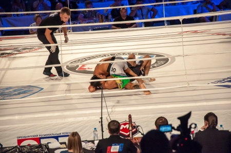 Mixed fighting Championship Edition. 29.06.2013 year, the city of Orenburg. MMA fights without rules. Blue corner Agoni Romero, Spain and in the Red corner, Rinat Kultumanov, Russia. Victory Agoni Romero.のeditorial素材