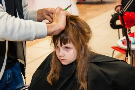 Girl in a beauty salon doing hairdoのeditorial素材