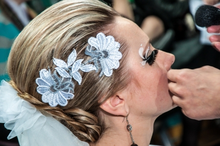 Makeup artist bring make-up girl のeditorial素材