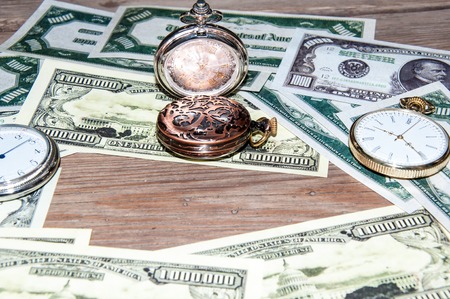 Pocket Watch and money. The concept of business time is moneyの写真素材