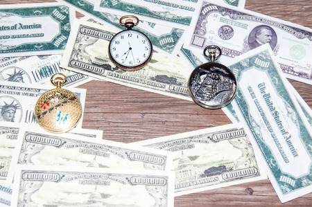 Pocket Watch and money. The concept of business time is moneyの写真素材