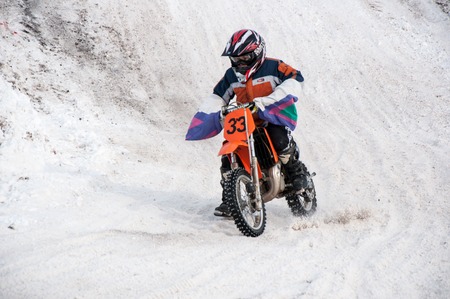 ORENBURG  ORENBURG region RUSSIA 10 March 2014 year. Winter cross-country motorcycle race competitions of childrenのeditorial素材