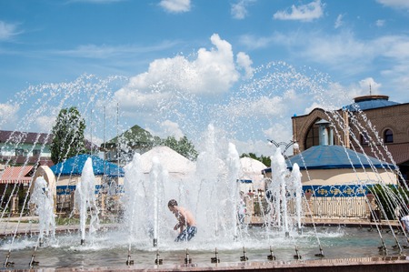 ORENBURG, ORENBURG region, RUSSIA, 5 June, 2014 year. Children bathe in the fountainのeditorial素材