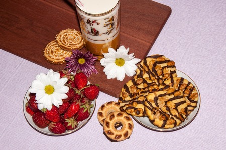 Strawberries milkshake and cookies and flower of Chrysanthemumの写真素材