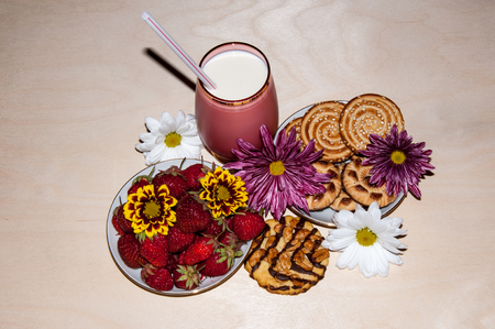 Strawberries milkshake and cookies and flower of Chrysanthemumの写真素材