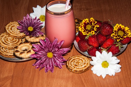 Strawberries milkshake and cookies and flower of Chrysanthemumの写真素材