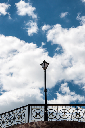 Street lamp blue sky and white cloudsの写真素材