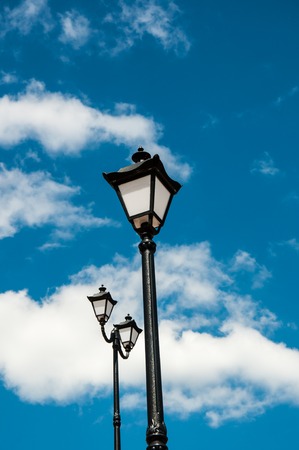 Street lamp blue sky and white cloudsの写真素材