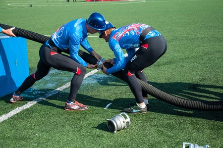 ORENBURG, ORENBURG region, RUSSIA, 8 August, 2014 year. 23 Championship The Ministry of emergency situations of Russia fire-applied sports. Fireman military deployment のeditorial素材