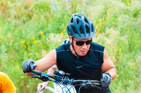 ORENBURG, ORENBURG region, RUSSIA, 10 August, 2014 year. Competitions cyclists in cross-country のeditorial素材