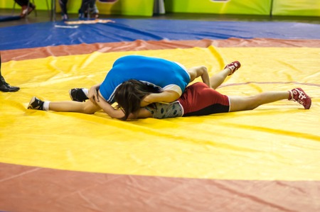 ORENBURG, ORENBURG region, RUSSIA, 18 January, 2014 year. Competitions on wrestling. Fighter girlsのeditorial素材