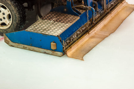 Machine for resurfacing ice on a hockey field