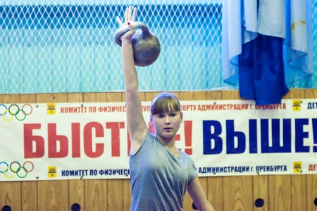 ORENBURG, ORENBURG region, RUSSIA, 31 October, 2014 year. City tournament on weight lifting among boys and girls, dedicated to the memory of Bolshakova. The girl in the kettlebell sportのeditorial素材