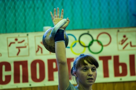 ORENBURG, ORENBURG region, RUSSIA, 31 October, 2014 year. City tournament on weight lifting among boys and girls, dedicated to the memory of Bolshakova. The girl in the kettlebell sportのeditorial素材