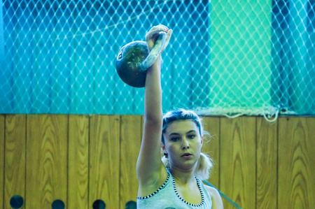 ORENBURG, ORENBURG region, RUSSIA, 31 October, 2014 year. City tournament on weight lifting among boys and girls, dedicated to the memory of Bolshakova. The girl in the kettlebell sportのeditorial素材