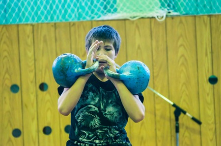 ORENBURG, ORENBURG region, RUSSIA, 31 October, 2014 year. City tournament on weight lifting among boys and girls, dedicated to the memory of Bolshakova. The boy in the kettlebell sportのeditorial素材