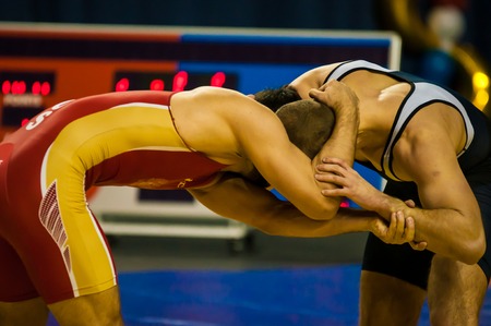 ORENBURG - 30 October: All-Russia tournament wrestling for the prizes of the Governor of Orenburg oblast. Two fighter  30 October 2014 in ORENBURG, ORENBURG region, RUSSIA.のeditorial素材