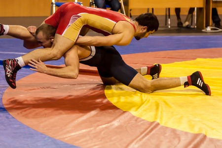 ORENBURG - 30 October: All-Russia tournament wrestling for the prizes of the Governor of Orenburg oblast. Two fighter  30 October 2014 in ORENBURG, ORENBURG region, RUSSIA.のeditorial素材