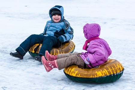 Orenburg, Orenburg region, Russia - 18 January 2015: Baby winter sledding on the Ural Riverのeditorial素材
