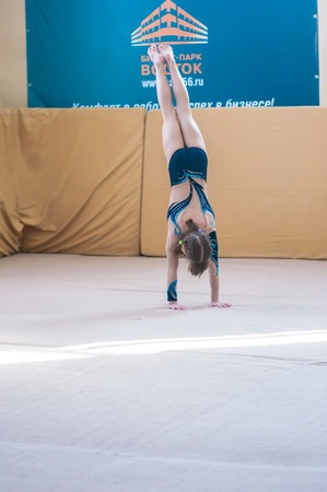 ORENBURG, ORENBURG region, RUSSIA - 20 February 2015: Gymnast girl performs at the Championship in artistic gymnasticsのeditorial素材