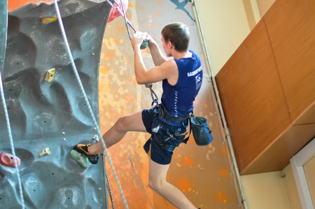 Orenburg, Orenburg region, Russia - 13.10.2012: Young people competing in rock climbing.のeditorial素材