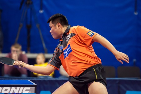 Orenburg, Russia - 03.04.2015: Game tennis Dimitrij OVTCHAROV "Fakel Gazproma Orenburg" and HOU Yingchao "Weinviertel Lower Austria" (Austria) in Semifinal League European champions in table tennis. Victory Dimitrij OVTCHAROV 3:1 (11:8, 11:13, 11:7, 11:8)のeditorial素材