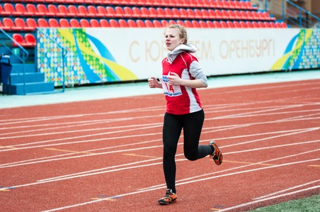 Orenburg, Russia - 24 April 2015: Girls compete in the run on the sports contest students of institutions of secondary vocational education "Youth of the Orenburga"のeditorial素材