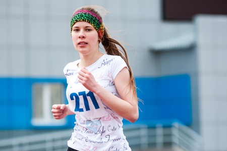 Orenburg, Russia - 24 April 2015: Girls compete in the run on the sports contest students of institutions of secondary vocational education "Youth of the Orenburga"のeditorial素材
