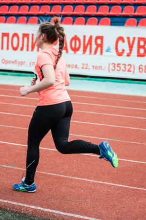 Orenburg, Russia - 24 April 2015: Girls compete in the run on the sports contest students of...