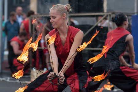 Orenburg, Russia - 25.07.2014: Juggling burning torches at sporting events