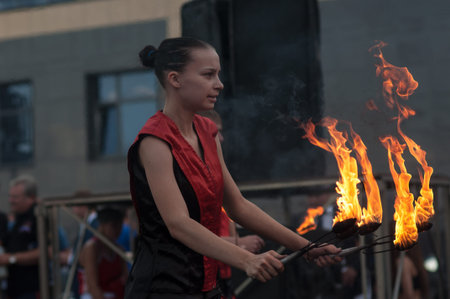 Orenburg, Russia - 25.07.2014: Juggling burning torches at sporting events