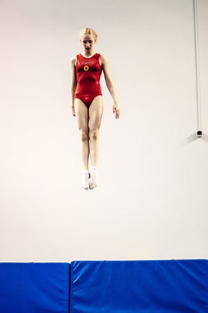Orenburg, Russia - 19 April 2016: Girls compete in jumping on the trampoline on Championship privolzhskiy districtのeditorial素材