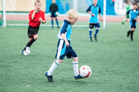 Orenburg, Russia - 1 June 2016: The boys play football in the preliminary games football festival "Lokobol-2016"のeditorial素材
