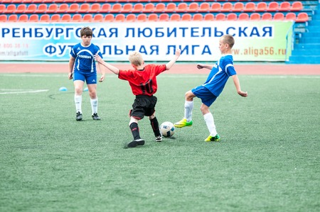 Orenburg, Russia - 1 June 2016: The boys play football in the preliminary games football festival "Lokobol-2016"のeditorial素材