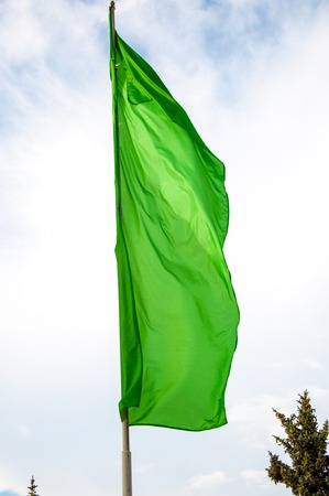 Colorful flags are swaying in the breeze on a summer dayの写真素材