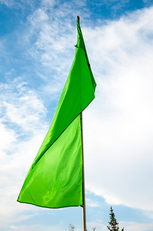 Colorful flags are swaying in the breeze on a summer dayの写真素材