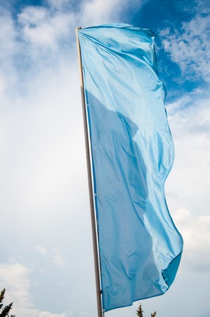 Colorful flags are swaying in the breeze on a summer dayの写真素材