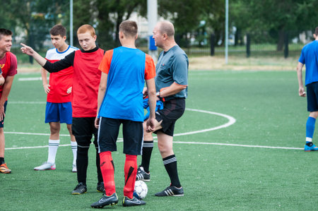 Orenburg, Russia - 9 July 2016: The boys play football at the city tournament on mini-football among childrens amateur teams memory trainer Kolosovaのeditorial素材