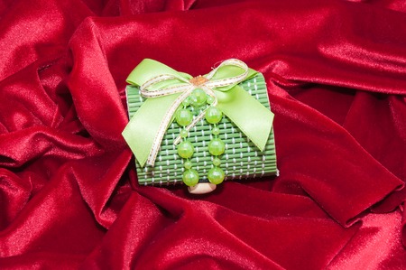 Gift in a box decorated with colorful ribbonsの写真素材