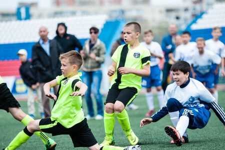 Orenburg, Russia - 1 June 2016: The boys play football in the preliminary games football festival "Lokobol-2016".のeditorial素材