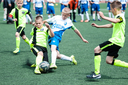 Orenburg, Russia - 1 June 2016: The boys play football in the preliminary games football festival "Lokobol-2016".のeditorial素材