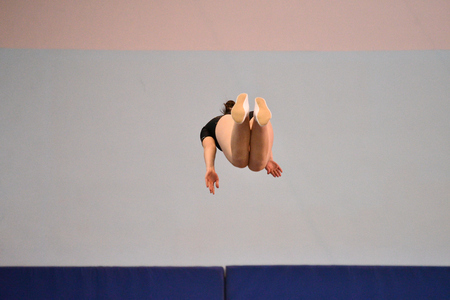Orenburg, Russia - January 27, 2017: Girls compete in jumping on the Double mnni-trampoline on competitions at the Orenburg region among Juniorsのeditorial素材