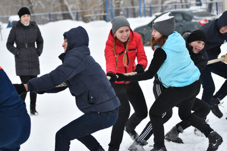 Orenburg, Russia-January 26, 2017 year: Students compete in the tug-of-war in the winter games,...