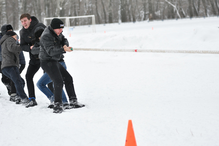 Orenburg, Russia-January 26, 2017 year: Students compete in the tug-of-war in the winter games, dedicated to Day studentsのeditorial素材
